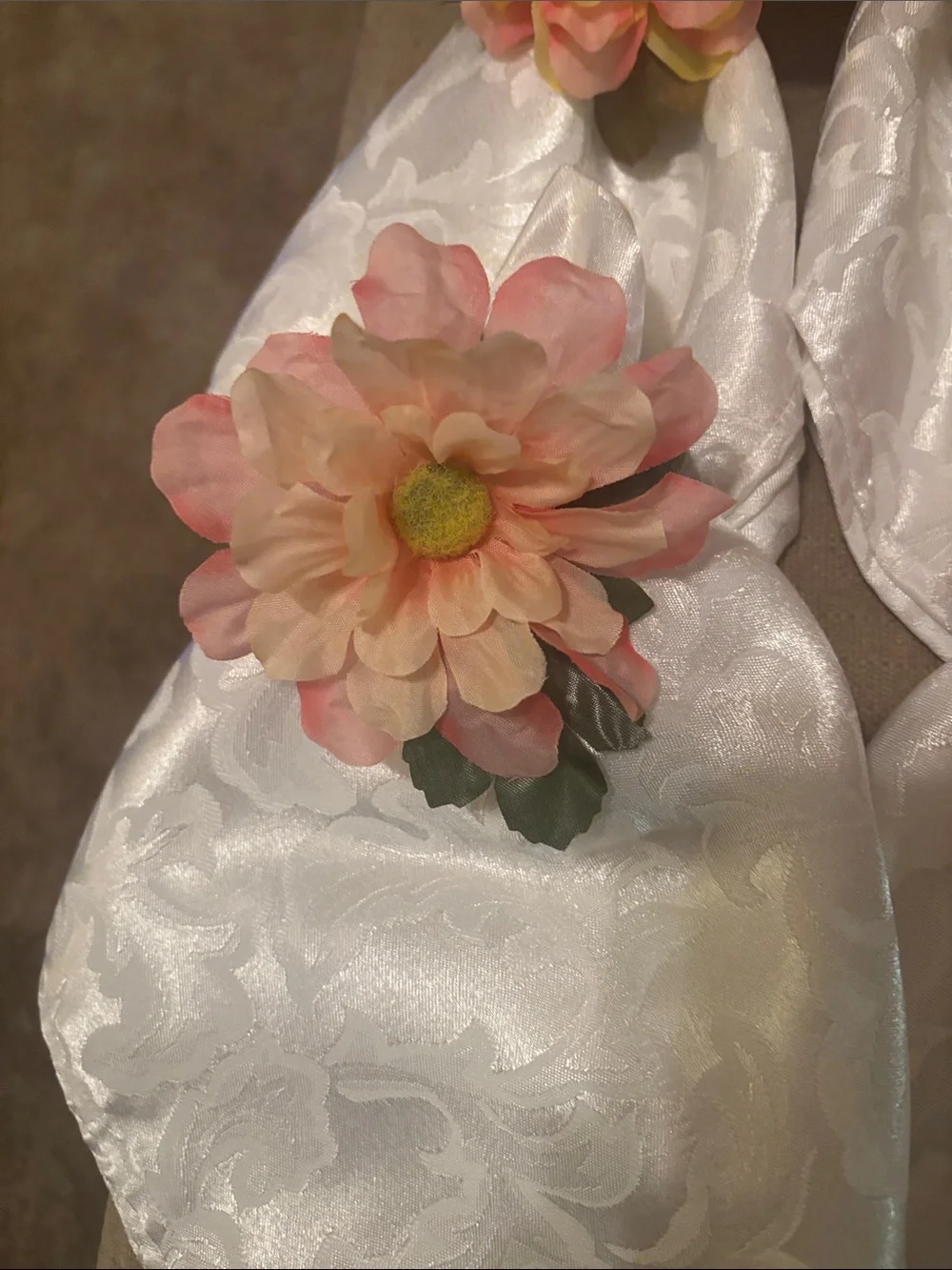 Six White easy care napkins and 6 beautiful floral napkin rings